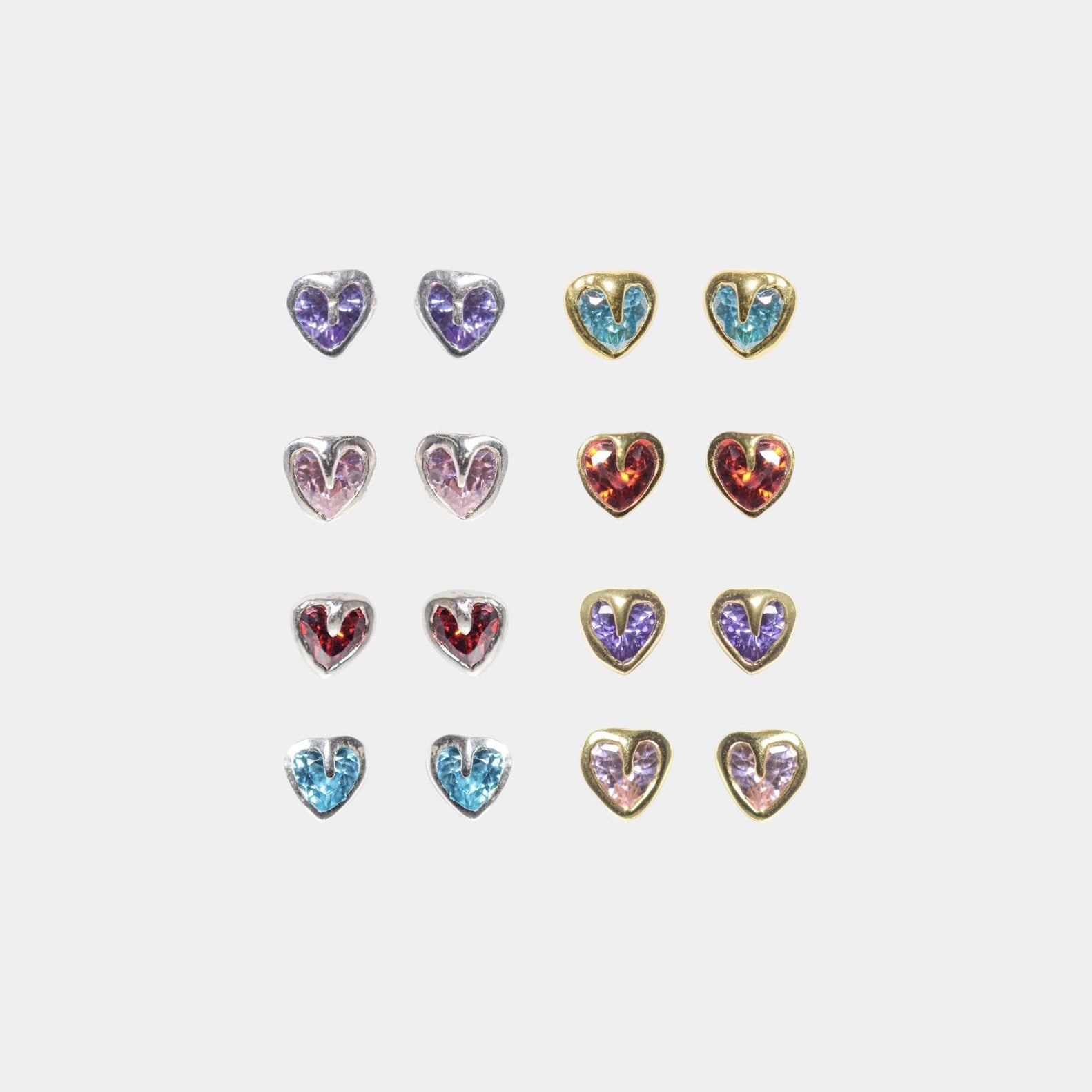 A collection of tiny heart-shaped stud earrings in various colors including pink, purple, aqua, lime, and red, displayed in silver and gold.